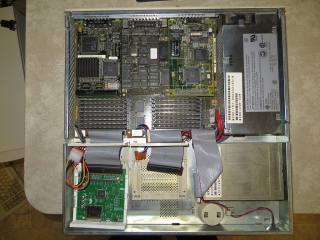 The inside of the Sparcstation 1 showing the SCSI2SD V5.1 SCSI disk / cd Emulator.   It is configured as a 2GB disk, and also hosts the CD ROM used to load the software.  (It also has, in different parts of the SD card, another 2GB disk and the Solaris 7 CD).
